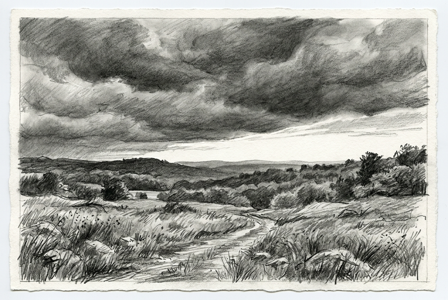 Graphite landscape of dense storm clouds above rolling hills, with a bright strip of sky along the horizon and a winding path through foreground grasses and stones.