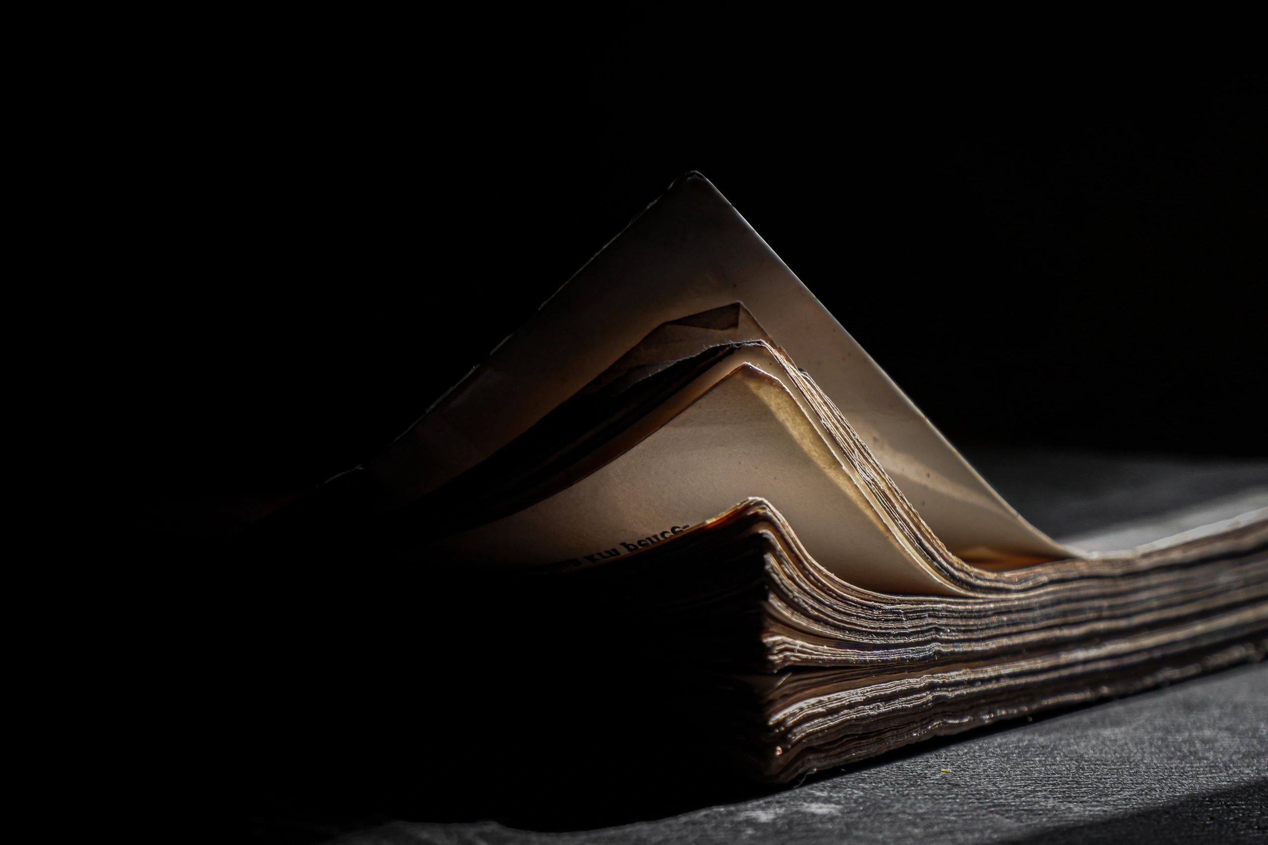 Close-up of a thick book in low light