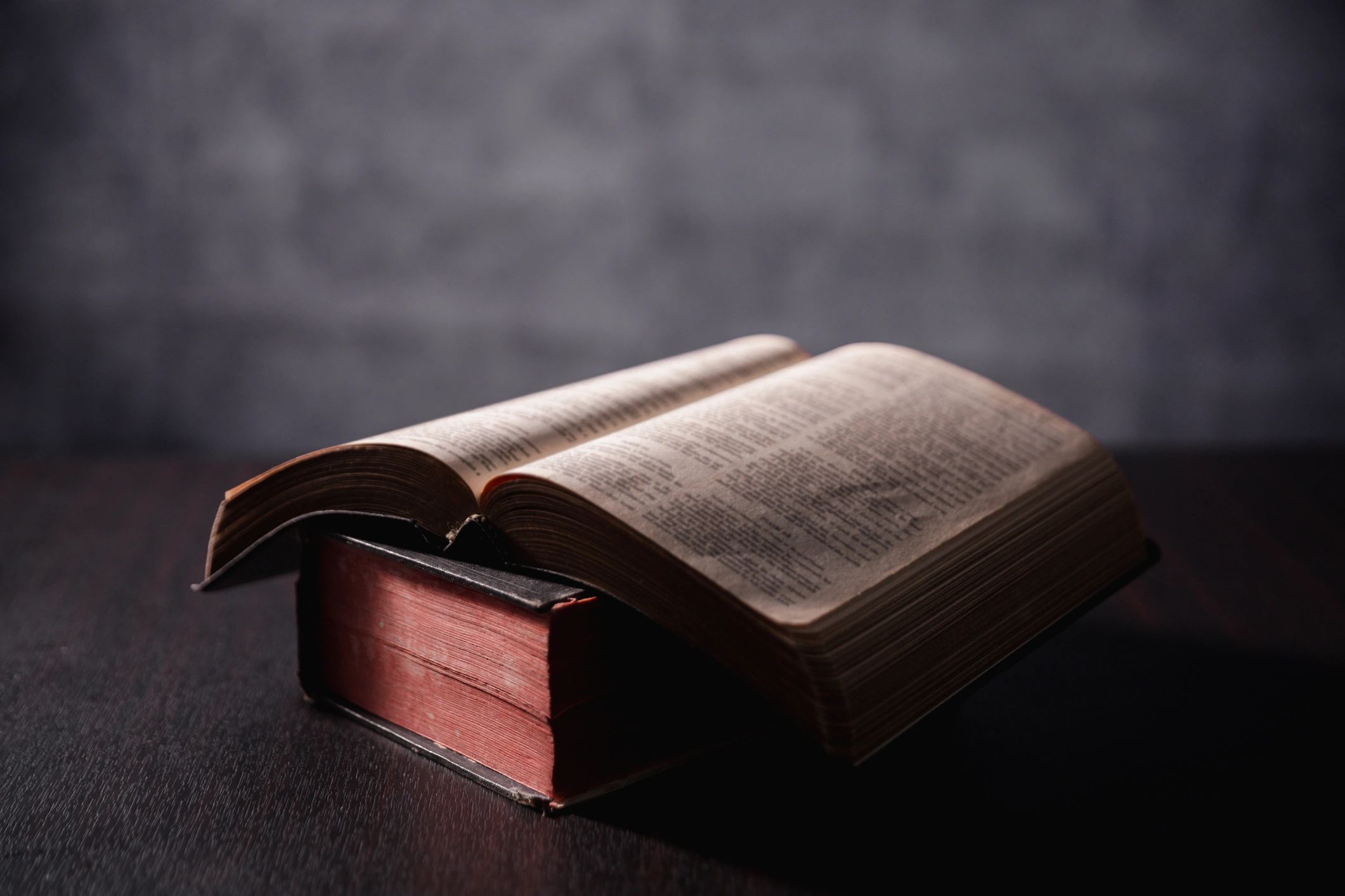 Open Bible on a dark background