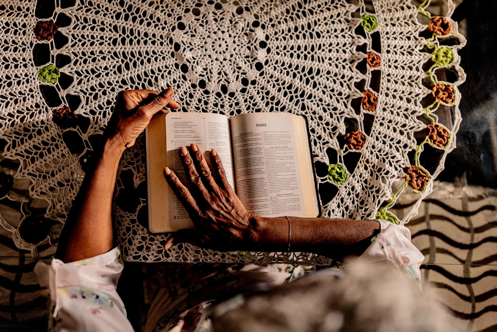 Hands holding a Bible close up